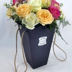 rainbow roses in gift vase