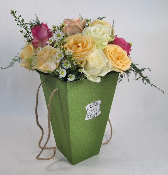 rainbow roses in gift vase