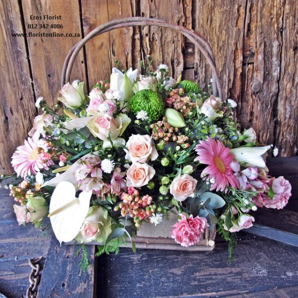 Pink seasonal flower basket by Eros Florist